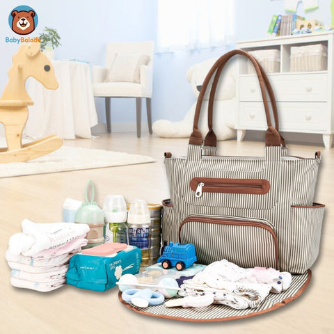 sac à langer avec plusieurs poches et compartiments de rangement des affaires de bébé