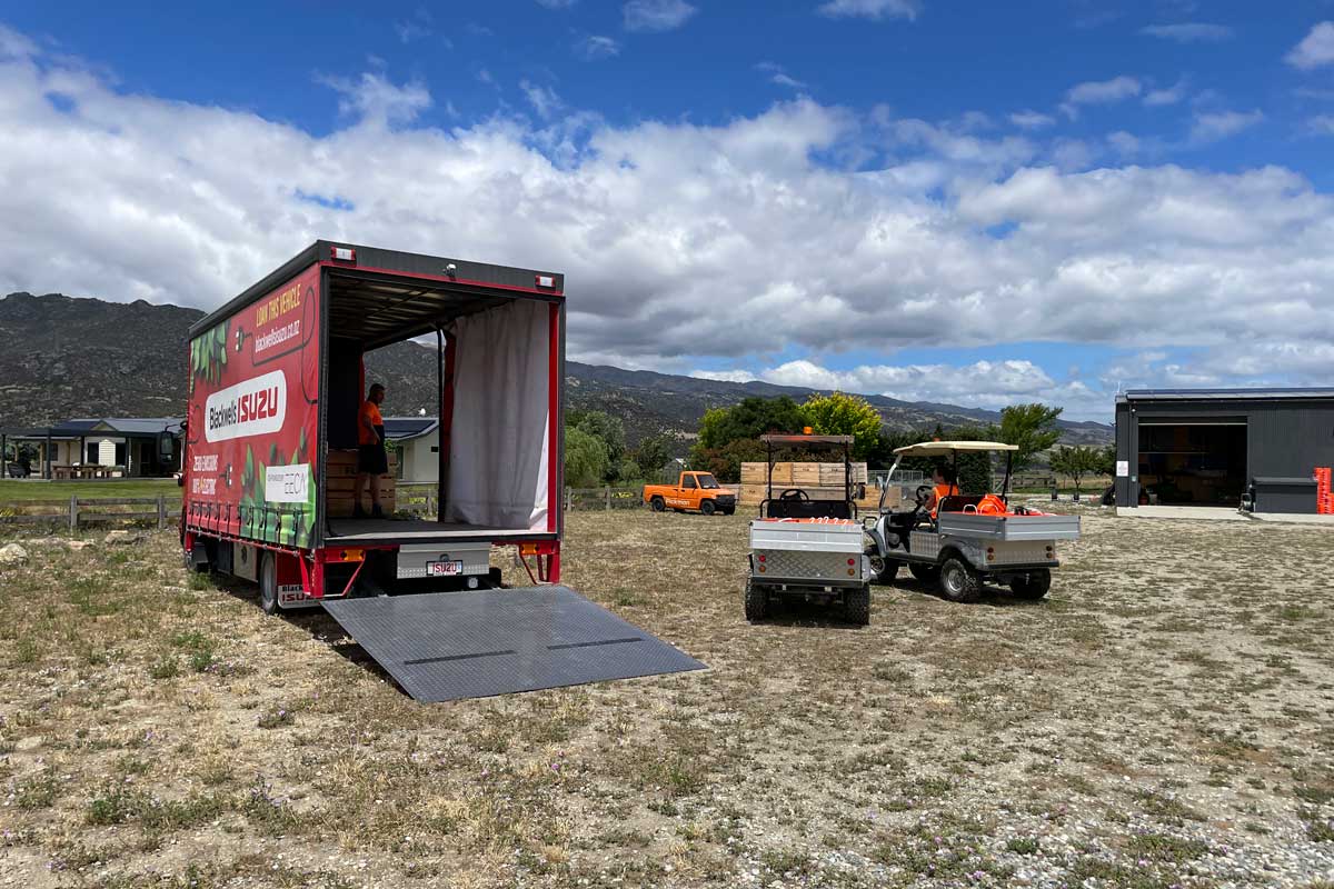 The e-truck alongside our other electric vehicles, being loaded up during one of our harvest days.