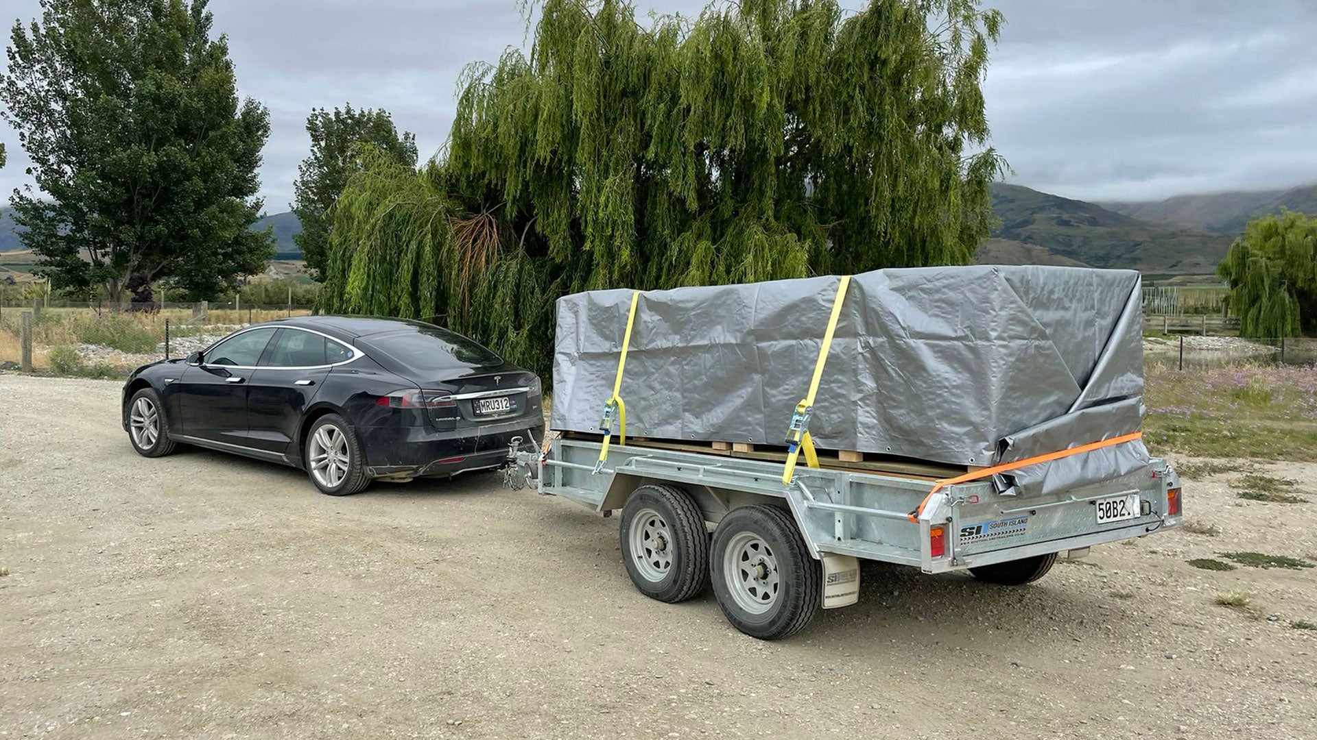 Johnny's Tesla hooked up to the trailer full of NZ0 cherries and ready to be delivered to the pack house.