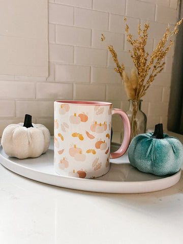 cute pumpkin coffee mug on kitchen counter