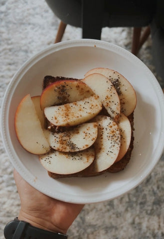 Apple slices with almond butter and chia seeds 