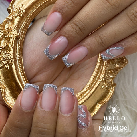 "Image: Poly Gel hybrid gel nails featuring a flawless manicure with a natural, sleek finish. The nails are expertly sculpted and shaped using Poly Gel, a revolutionary nail enhancement product. The Poly Gel provides strength and flexibility, resulting in a long-lasting and durable manicure. The nails are beautifully painted in a range of stunning colors, showcasing the versatility and beauty of hybrid gel nails achieved with Poly Gel technology."