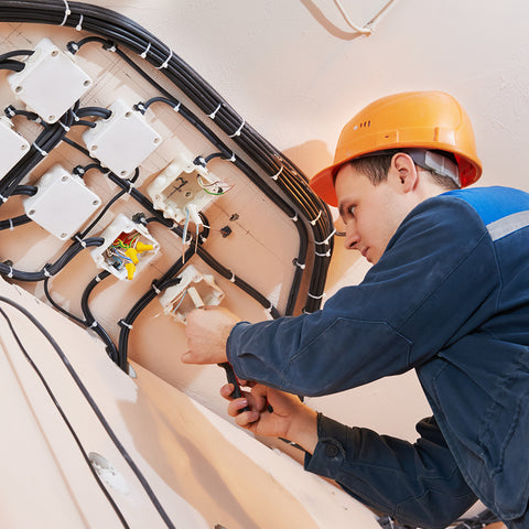 man working on electrical wiring