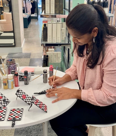 Painting on luggage tags -Live Event Activation at Bloomingdales 