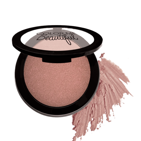 Pink blush in an open compact with some loose powder beside it.