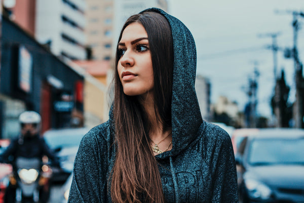 Women's wearing black sporty hoodie