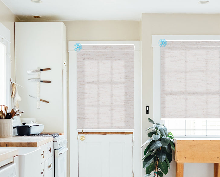 Roller blinds filter light in bright kitchen