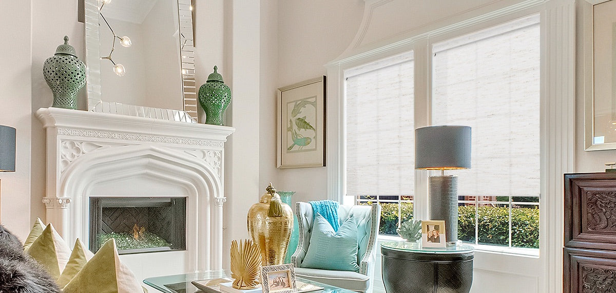 Morden design living room with linen white roller shades.