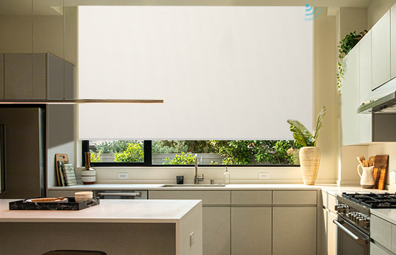 Bright sunlight shines through the shades in the open kitchen.