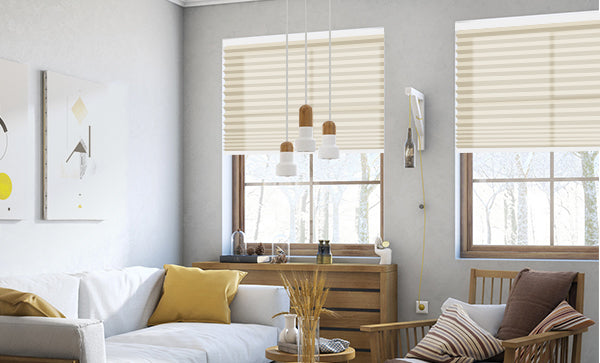 The warm living room features a ginger throw pillow, wheat color ornament, and cream motorized cellular shades