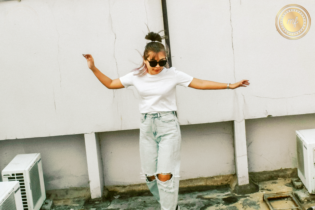 Woman blissfully dances on rooftop, in intoxicated delight