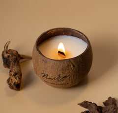 all-natural soy wax coconut and vanilla scented candle in natural coconut shell.