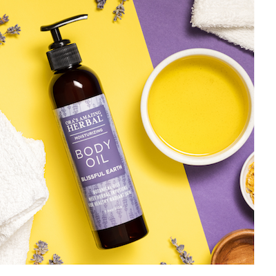 Ora's Amazing Herbal Blissful Earth Body Oil with purple background