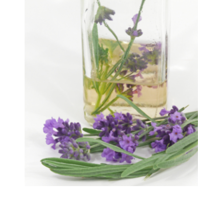 lavender flowers next to a vase