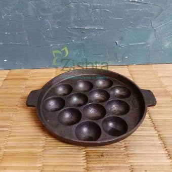 https://cdn.shopify.com/s/files/1/0573/0982/3116/products/cast-iron-kuzhi-paniyarakal-paddu-appe-tawa-12cavity-zishta-traditional-cookware_340x.jpg?v=1656056516