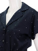 detail view of melita polka dot jumpsuit in navy collar 