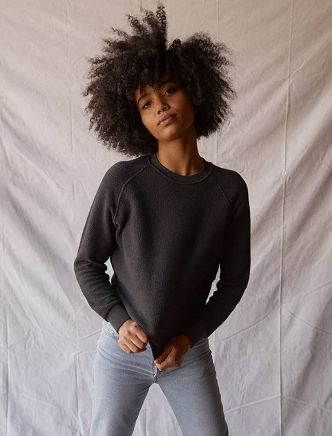 Model wearing Perfectwhitetee's ziggy inside out sweatshirt in vintage black.