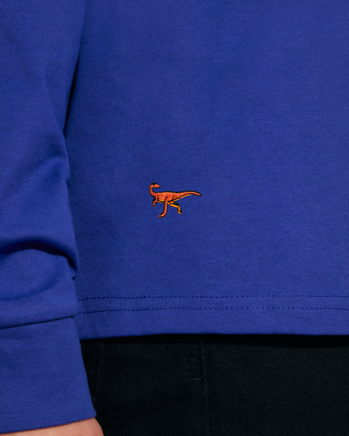 a blue INGMARSON top with dinosaurs 
