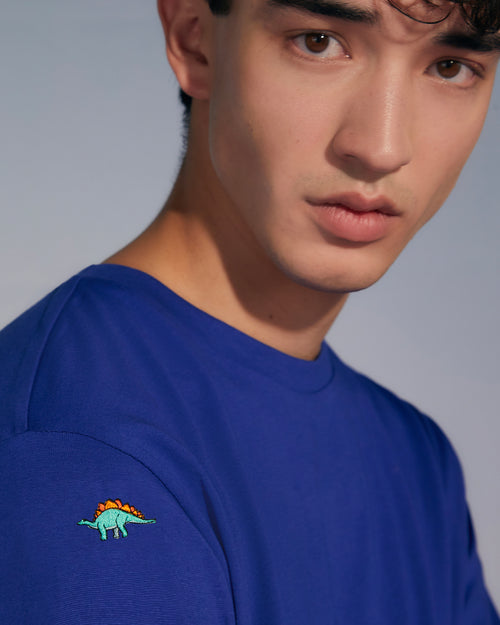 a young man wearing a blue shirt