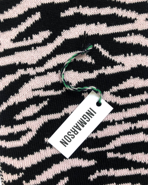 a pink scarf with tiger print