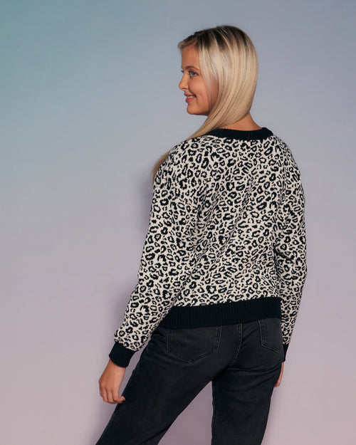 a knitted jumper in leopard pattern