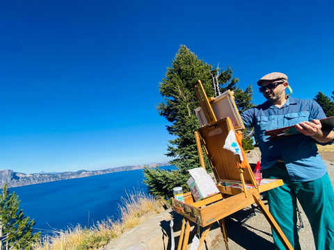 A man painting Crater Lake