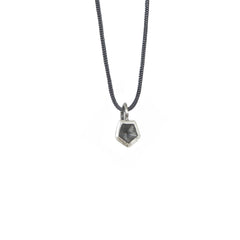 Vertigo Mini Classic Pendant no reviews Style Blackened SilverPolished Silver Chain style noneSilver chain 40cm (16inch)Silver chain 45cm (18inch)Black cord €25,00 Quantity: - 1 + Subtotal:€25,00 Add To Wishlist DETAILS CUSTOMER REVIEWS MATERIAL CARE & TIPS SHIPPING & RETURNS Cute geometric mini charm on fine sterling silver chain, featuring a small pentagon. Minimal and cute, this necklace is perfect by itself for an everyday modern style, and works wonders pair with one of the Vertigo Mini choker with a crystal stone.  You can mix and match differet finishes and metals for a great layering effect!      The mini vertigo pendant is part of a series of cute simple stack-able rings, earrings, necklaces and pendants. You can find them in different silver finishing and different metals. This pendants are designed with a 3D modelling software and finished by hand. There are different designs and 2 different finishes that you can mix and match and even stack together!  Length of the chain is 40cm, but can be customized.     BLACKENED SILVER: These jewels are made out of oxidized sterling silver. The black is achieved by the use of a patina.      POLISHED SILVER: These jewels are made out of a special tarnish-resistant sterling silver. This special silver will not tarnish as easily as the normal sterling silver. They are highly polished by hand.  Materials: Sterling silver  Measurements: choose the length that better works for you between 40 and 45 cm (16 and 18unch) or an adjustable black cord    Very simple minimalist design can be stack and match in different metal. Romantic and delicate.