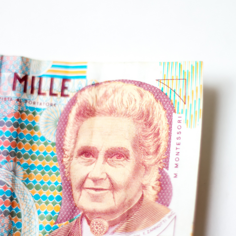 A Picture of an Old Italian Bank Note With An Image Of Maria Montessori