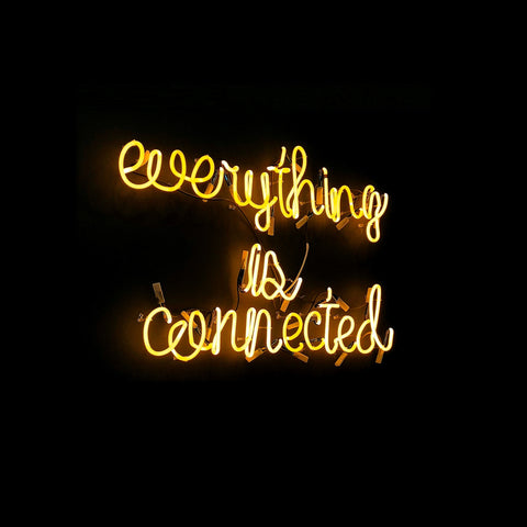 Everything is connected Yellow Neon Sign on a Black Background