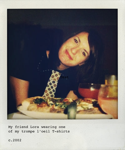 a woman wearing a black T-shirt with trompe l'ceil collar and appliqué tie in Lucienne Day fabric