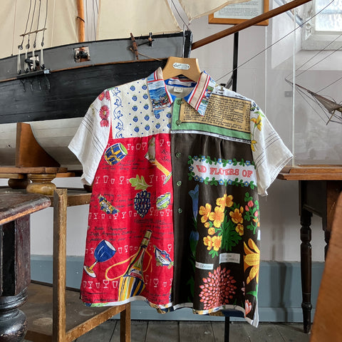 shirt made from a patchwork of recycled tea towels, featuring trees, cocktails, wild flowers and strawberries