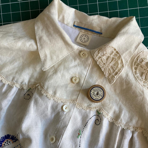Linen shirt hand made from a recycled vintage cutwork tablecloth and hand finished with Sylko thread