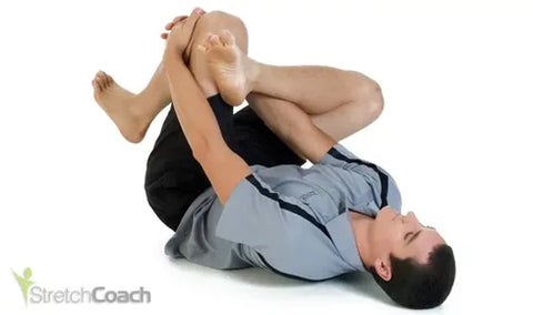 A man performing a piriformis stretch