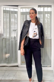 Black leather jacket with a woman's t-shirt with a print of the essence of sub-Saharan Africa