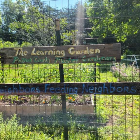 the learning garden sign at community garden