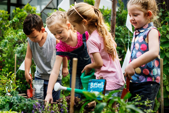 children watering garden