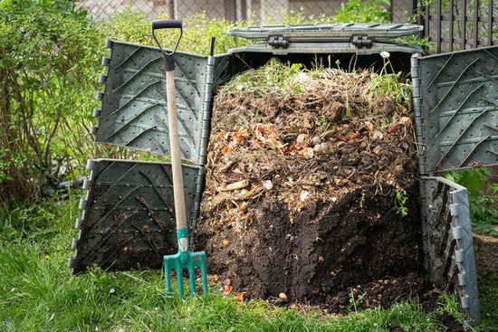 compost bin and pitchfork