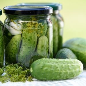 homemade pickled cucumbers stored in clear jar