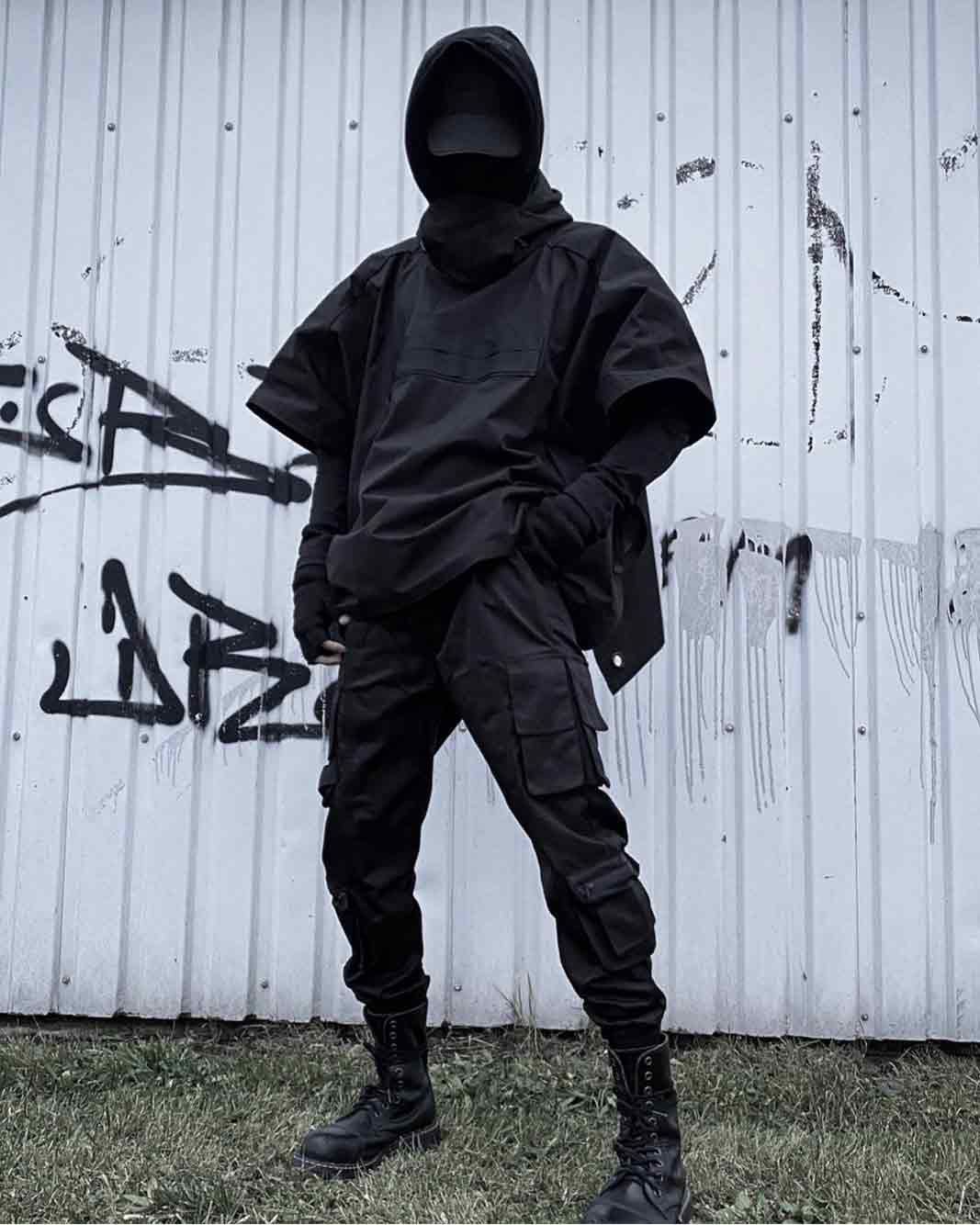 darkwear man with techwear boots, black cargo pants and darkwear jacket