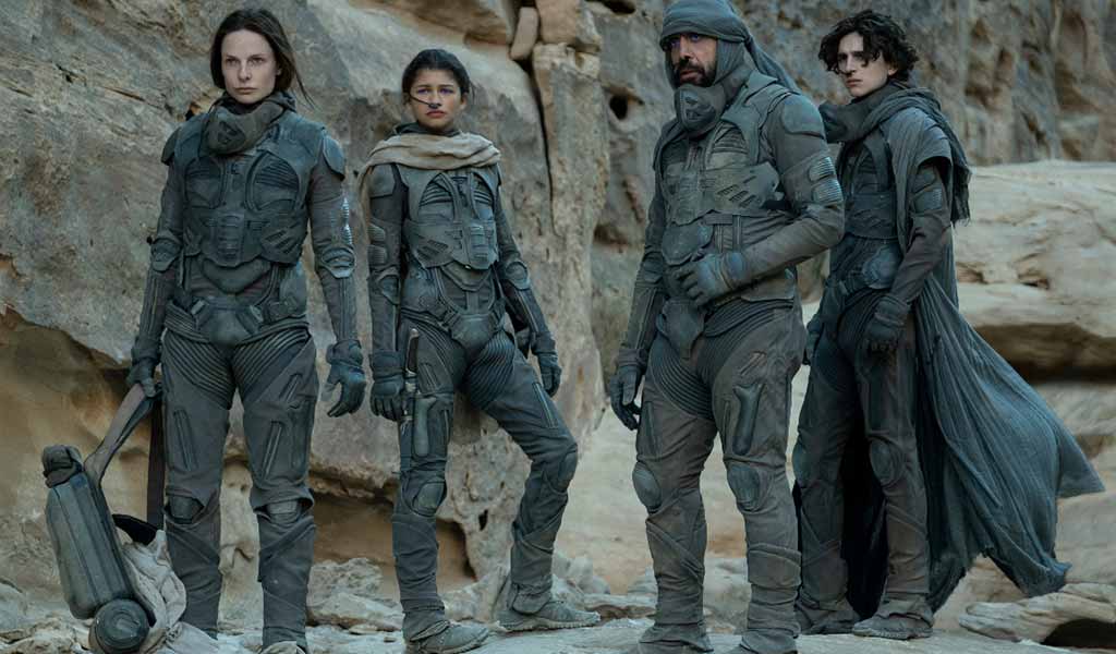 4 people wear dune clothing for a post apocalyptic clothing style