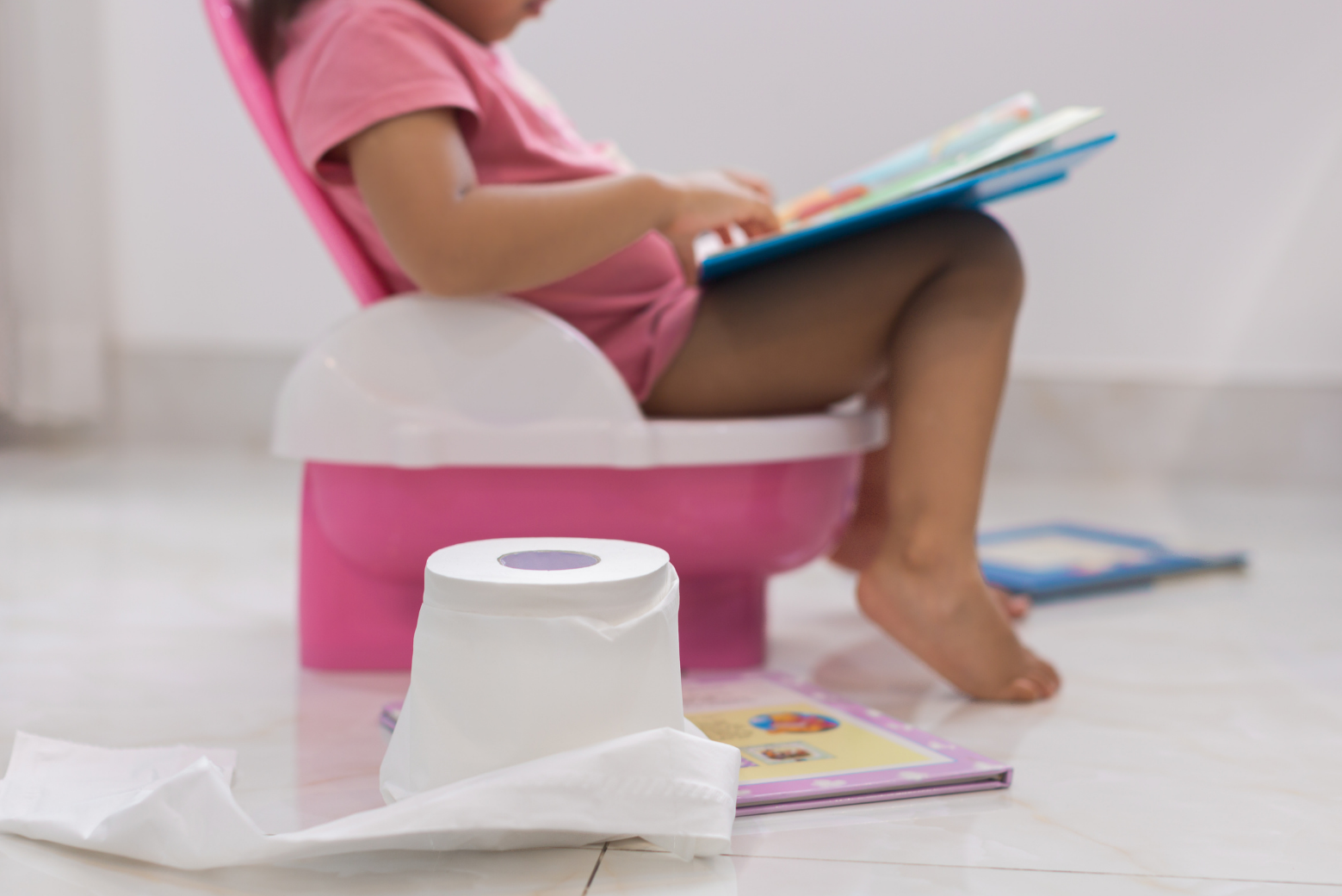 image of girl sitting on training potty