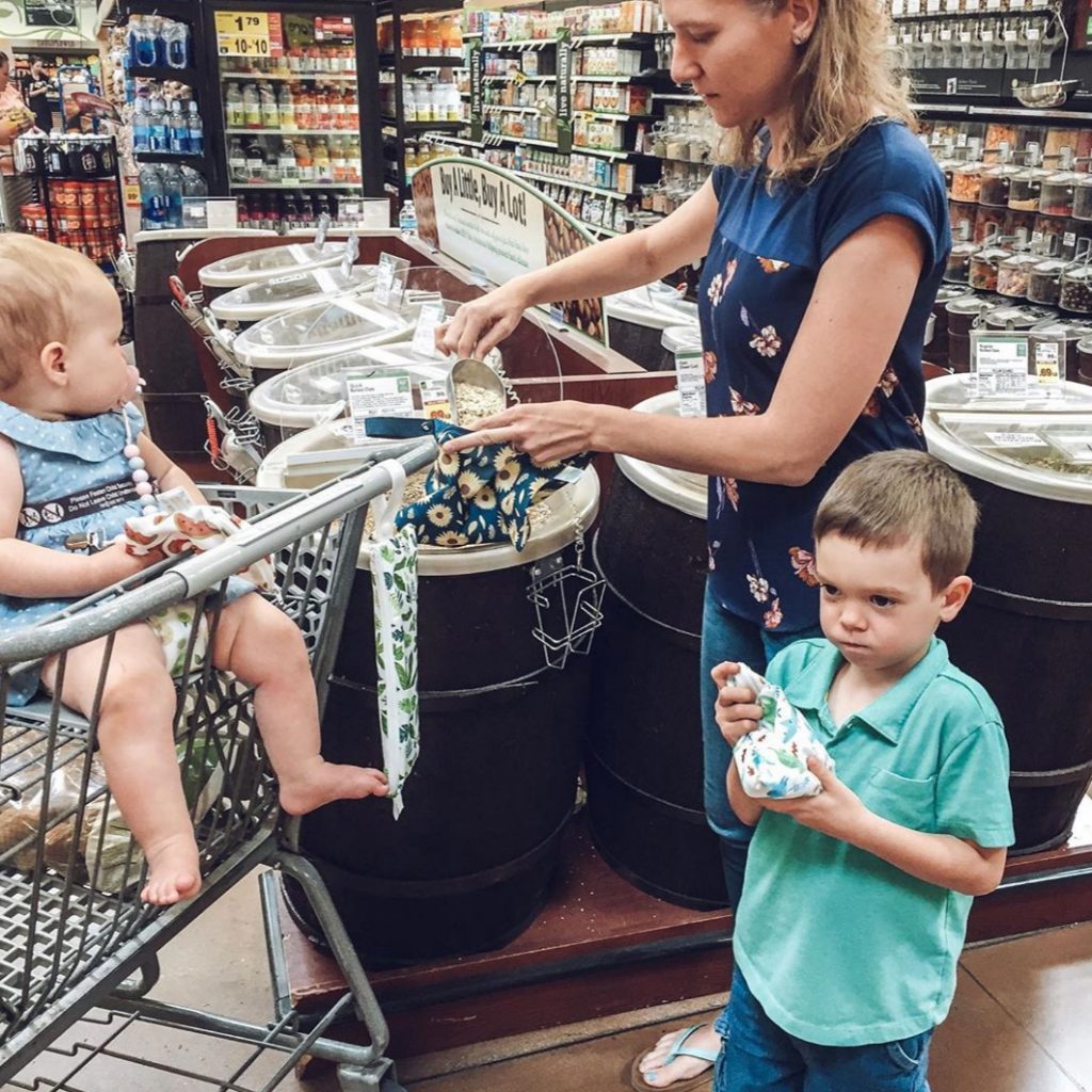 image of baby in shopping cart at grocery store