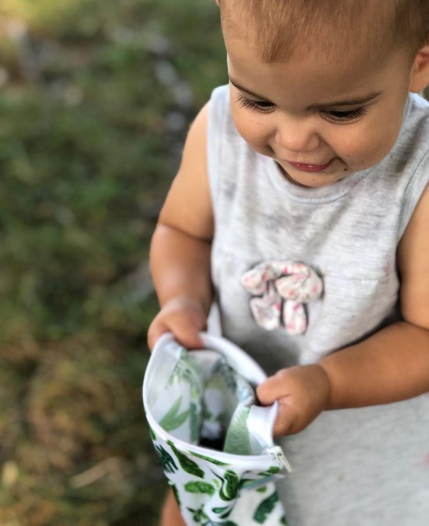 image of child holding bag with cactus print