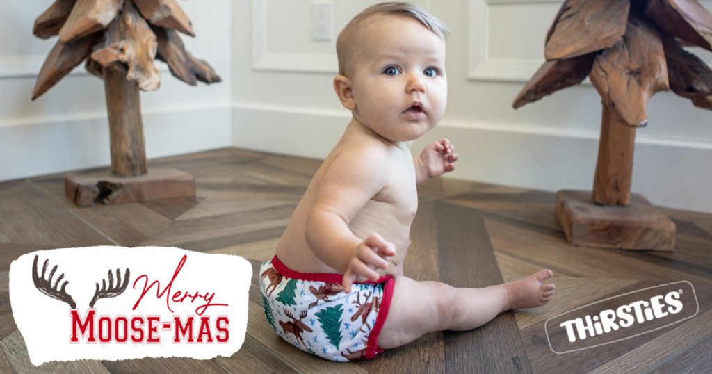 image of baby on the floor with a diaper in a moose print