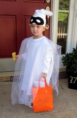 Layer white tulle over a long white shirt - smart! And a plain black mask to still get the ghost look without having a sheet over your kids' head. Craft, Interrupted: BOO! A Homemade Ghost Costume.: 