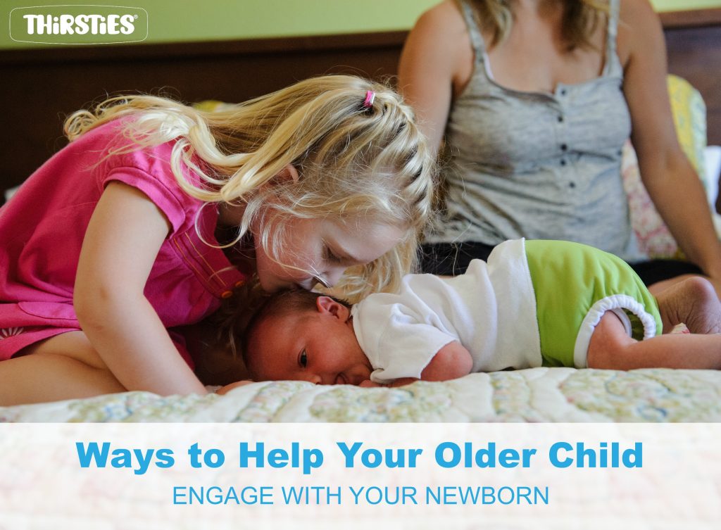 image of older child kissing a baby