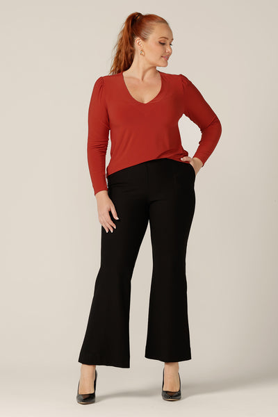 Good work tops for petite to fuller figure women, L&F's great range of women's tops includes this V-neck jersey top with long sleeves. In orange dry-touch jersey, this comfortable top is worn with bootleg, flared leg black pants.