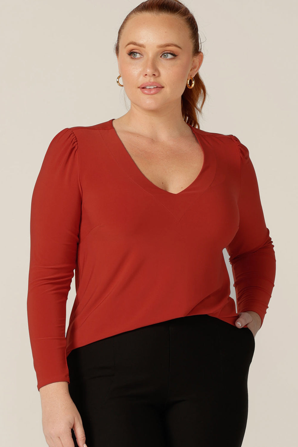 Good work tops for petite to fuller figure women, L&F's great range of women's tops includes this V-neck jersey top with long sleeves. In orange dry-touch jersey, this comfortable top is good for revitalising workwear suits and pants.