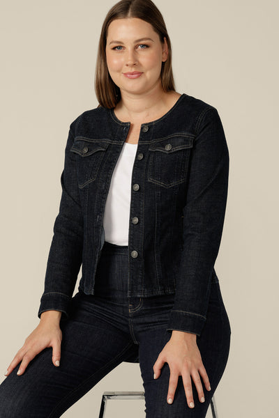 A collarless denim jacket in size 12 is worn with white bamboo jersey T-shirt and super-stretch skinny jeans. Consciously made in partnership with Outland Denim, this denim jacket is tailored to fit women in sizes 8 to 24 by Australian and New Zealand women's clothing experts, L&F.