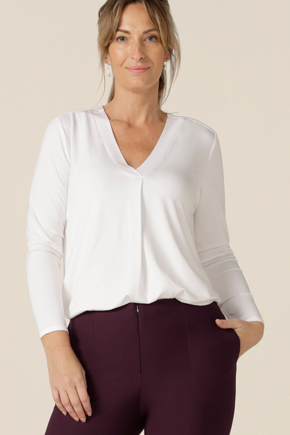 A great top for work or casual wear, this long sleeve, V-neck top in white bamboo is a clothing essential that will match with your capsule wardrobes. Made in Australia by Australian and New Zealand women's clothing brand, L&F.